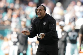 Las Vegas Raiders interim head coach Antonio Pierce gestures during the first half of an NFL football game against the Miami Dolphins, Sunday, Nov. 19, 2023, in Miami Gardens, Fla. 