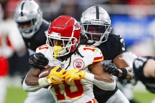 Kansas City Chiefs running back Isiah Pacheco (10) runs the ball as Las Vegas Raiders cornerback Nate Hobbs (39) tries to tackle him during the first half of an NFL football game at Allegiant Stadium Sunday, Nov. 26, 2023.