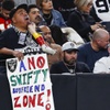 A Las Vegas Raiders fan holds a sign during the second half of an NFL football game against the Kansas City Chiefs at Allegiant Stadium Sunday, Nov. 26, 2023.