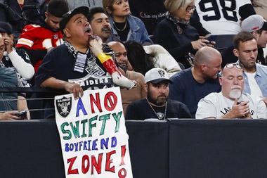 A Las Vegas Raiders fan holds a sign during the second half of an NFL football game against the Kansas City Chiefs at Allegiant Stadium Sunday, Nov. 26, 2023.