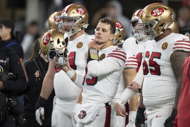 San Francisco 49ers quarterback Brock Purdy, center, is pictured during warmups before an NFL football game against the Seattle Seahawks, Thursday, Nov. 23, 2023, in Seattle. The 49ers won 31-13.