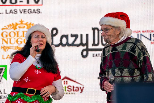 Misty Rose Dare & Fred Gentler sing Run Santa Run at the pre-show festivities at the Las Vegas Great Santa Run on Saturday, Dec. 2, 2023.