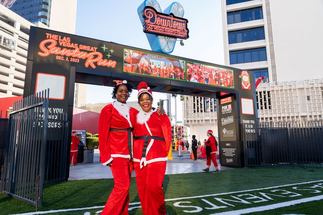 Belinda Foreman, left and Lorie Foreman enjoy the pre-show festivities at the Las Vegas Great Santa Run on Saturday, Dec. 2, 2023.