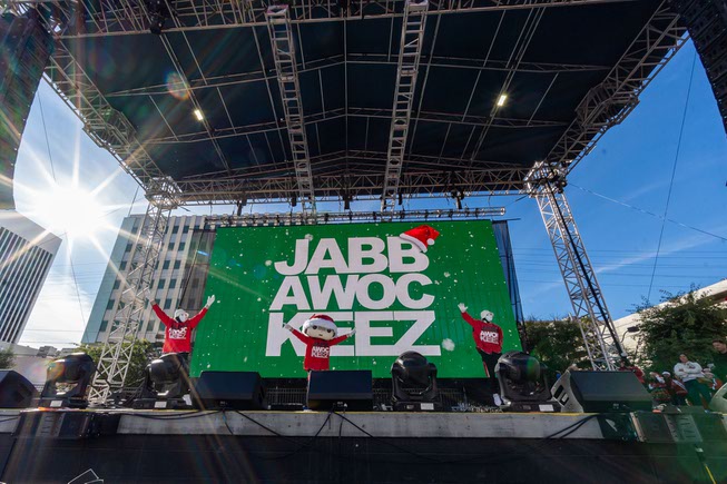 Participants dance and enjoy the pre-show festivities, featuring performances by the Blue Man Group, Jabbawockeez, and many more at the Las Vegas Great Santa Run on Saturday, Dec. 2, 2023.