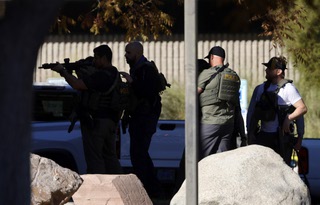 Law enforcement officers are shown on UNLV campus after reports of an active shooter Wednesday, Dec. 6, 2023.