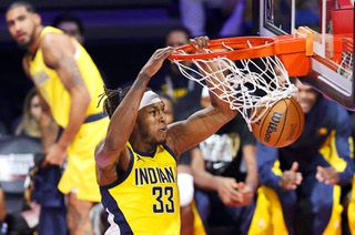 Indiana Pacers center Myles Turner (33) dunks against the Milwaukee Bucks during the second half of an NBA In-Season Tournament semifinal game at T-Mobile Arena Thursday, Dec. 7, 2023, in Las Vegas. The Pacers defeated the Bucks 128-119.