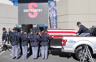 Nevada State Police troopers remove the casket from a truck before a memorial service for Nevada State Police Trooper Alberto Felix at Central Church Thursday, Dec. 7, 2023, in Henderson. Felix and Nevada State Police Sgt. Michael Abbate were killed in an hit-and-run accident on I-15 on Nov. 30.