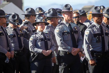 Nevada State Police Troopers head into Central Church before a memorial service for Nevada State Police Trooper Alberto Felix Friday, Dec. 8, 2023, in Henderson. Felix and Nevada State Police Sgt. Michael Abbate were killed in an hit-and-run accident on I-15 on Nov. 30.