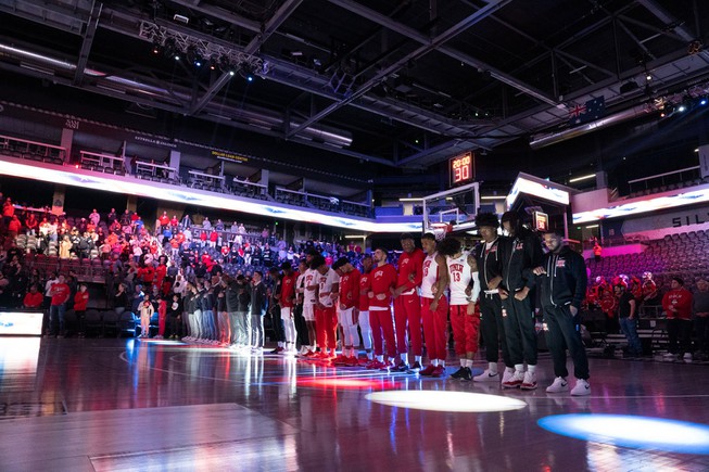 The UNLV men's basketball team participates in a moment of silence before their game against Loyola Marymount in the Jack Jones Classic at The Dollar Loan Center on Dec. 9, 2023. This is the first time UNLV played since the on-campus shooting that killed three professors and injured one.