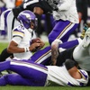 Minnesota Vikings quarterback Joshua Dobbs (15) gets sacked during the first half of an NFL football game against the Las Vegas Raiders at Allegiant Stadium Sunday, Dec. 10, 2023.