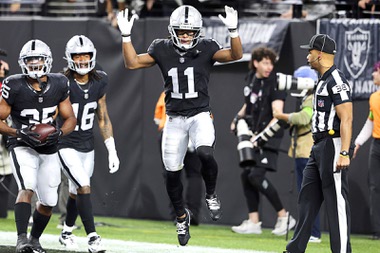 Las Vegas Raiders wide receiver Tre Tucker (11) celebrates after scoring a touchdown against the Los Angeles Chargers during the first half of an NFL football game, Thursday, Dec. 14, 2023, in Las Vegas. (AP Photo/Steve Marcus)