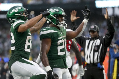 New York Jets running back Breece Hall (20) celebrates with wide receiver Xavier Gipson (82) after scoring a touchdown against the Houston Texans during the fourth quarter of an NFL football game, Sunday, Dec. 10, 2023, in East Rutherford, N.J.