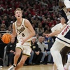 Purdue guard Fletcher Loyer (2) drives to the basket in front of Arizona center Oumar Ballo (11) in the second half of an NCAA college basketball game in Indianapolis, Saturday, Dec. 16, 2023