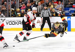 Vegas Golden Knights center Brett Howden (21) falls in front of Ottawa Senators right wing Claude Giroux (28) during the third period of an NHL hockey game Sunday, Dec. 17, 2023, in Las Vegas.