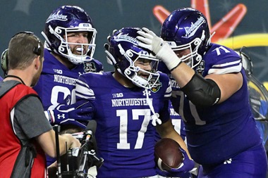 Northwestern wide receiver Bryce Kirtz (17) celebrates after his touchdown reception during the second half of the Las Vegas Bowl NCAA college football game against Utah, Saturday, Dec. 23, 2023, in Las Vegas.