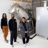 Managing partners Alexis and Martin McCurdy, left, and Lennette Smith, managing funeral director, pose in front of a low-temperature alkaline hydrolysis machine at Green Farewells Thursday, Dec. 28, 2023. The company offers Aquamation (alkaline hydrolysis), an eco-friendly alternative to flame cremation, which uses a water and alkalai treatment to break down the body into Aquamation ashes.