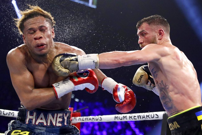 Vasiliy Lomachenko, right, lands a punch on undisputed lightweight champion Devin Haney during their title fight at the MGM Grand Garden Arena Saturday, May 20, 2023. Haney retained his titles by unanimous decision.