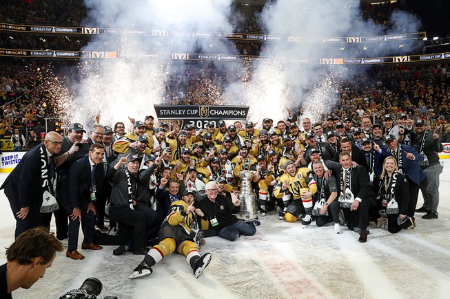 The Vegas Golden Knights pose for a team photo with the Stanley Cup Trophy after the Golden Knights beat the Florida Panthers 9-3 in Game 5 to win the Stanley Cup Final at T-Mobile Arena Tuesday, June 13, 2023, in Las Vegas.