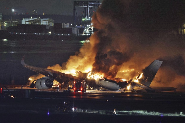 A Japan Airlines plane is on fire on the runway of Haneda airport on Tuesday, Jan. 2, 2024 in Tokyo, Japan.
