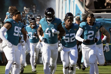 Jacksonville Jaguars players take the field during introductions before an NFL football game against the Carolina Panthers, Sunday, Dec. 31, 2023, in Jacksonville, Fla.