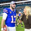 Buffalo Bills quarterback Josh Allen (17) smiles as he is interviewed by NBC Sports sideline reporter Melissa Stark on the field after the Bills defeated the Miami Dolphins during an NFL football game, Sunday, Jan. 7, 2024, in Miami Gardens, Fla.