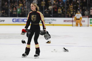 A member of the Vegas Golden Knights Knights Guard picks up hats after Vegas Golden Knights right wing Mark Stone (61) (not pictured) gets a hat trick after he scores during the second period of an NHL hockey game at T-Mobile Arena Monday, Jan. 15, 2024.