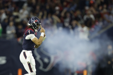 Houston Texans quarterback C.J. Stroud (7) looks to celebrate after a touchdown during an NFL wild-card playoff football game, Saturday, Jan. 13, 2024 in Houston.