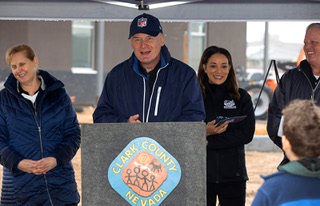 Jack Groh, center, director of the NFL Environmental Program (NFL Green), speaks during an NFL Green tree-planting event at the Silverado Ranch Community Center Tuesday, Jan. 23, 2024. Behind Groh, from left, are Susan Groh, associate director, Myisha Boyce, chief community engagement officer of the Las Vegas Super Bowl LVIII Host Committee, and John Dorn, associate director of Verizon.