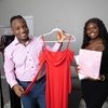 Soo Slick founders Alexander and Elizabeth Adeoye pose with a dress that has built-in shapewear during an interview at their home in Henderson Tuesday, Jan. 23, 2024.