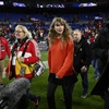 Taylor Swift, right, walks with Donna Kelce on the field after the AFC Championship NFL football game between the Baltimore Ravens and the Kansas City Chiefs, Sunday, Jan. 28, 2024, in Baltimore.