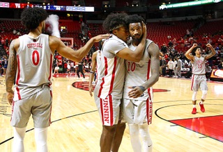 UNLV players, from left, Isaiah Cottrell (0), Rob Whaley Jr. (5), Kalib Boone (10) and Brooklyn Hicks (13) celebrate after defeating Fresno State, 78-69, in an NCAA basketball game at the Thomas & Mack Center Tuesday, Jan. 30, 2024.