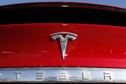 In this Feb. 2, 2020, file photo, the Tesla company logo is shown in Littleton, Colo.