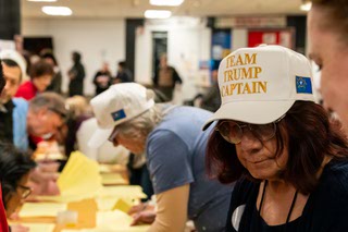 Trump supporters line-up around rows of tables inside the cafeteria of James Cashman Middle School in Las Vegas, Nevada, where the caucus was held on Thursday, February 8, 2024.