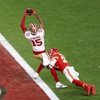 San Francisco 49ers wide receiver Jauan Jennings (15) scores a touchdown as Kansas City Chiefs safety Mike Edwards (21) tries to tackle him during the second half of the NFL Super Bowl 58 football game at Allegiant Stadium in Las Vegas Sunday, Feb. 11, 2024.