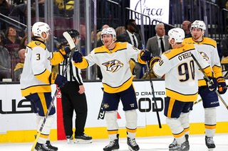Nashville Predators center Gustav Nyquist, center, is congratulated by teammates Jeremy Lauzon (3) and Ryan O'Reilly (90) after scoring an empty net goal against the Vegas Golden Knights in the third period of an NHL hockey game at T-Mobile Arena Tuesday, Feb. 20, 2024.