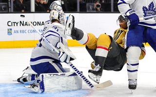 Vegas Golden Knights right wing Keegan Kolesar (55) falls in front of Toronto Maple Leafs goaltender Martin Jones (31) during the third period of an NHL hockey game at T-Mobile Arena Thursday, Feb. 22, 2024.