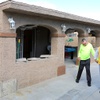 Homeowner Barbara Ojito and her disabled brother Julio Ojito walk by an unfinished back patio during a Nevada State Contractors Board news conference at a home Thursday, Feb. 29, 2024. Ojito hired an unlicensed contractor to do work on her house but the man did shoddy work and never finished the job, she said.