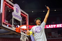 UNLV Lady Rebels forward Alyssa Brown, the game MVP, helps cut down the net after the Lady Rebels defeated the San Diego State Aztecs, 66-49, ...