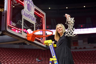 UNLV Lady Rebels head coach Lindy La Rocque  holds up the net after the Lady Rebels defeated the San Diego State Aztecs, 66-49, to win the Mountain West Conference championship game at the Thomas & Mack Center Wednesday, March 13, 2024.
