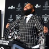 Christian Wilkins, a 6-4, 310-pound defensive tackle, displays a jacket with a playing card design in the liner during a news conference at the Intermountain Health Performance Center/Raiders Headquarters in Henderson Thursday, March 14, 2024. Wilkins joins the Raiders after spending the last five seasons with the Miami Dolphins.