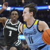 Marquette's Tyler Kolek drives past Providence's Jayden Pierre during the first half of an NCAA college basketball game Wednesday, Feb. 28, 2024, in Milwaukee.