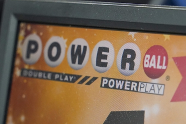 A display panel advertises tickets for a Powerball drawing at a convenience store, Nov. 7, 2022, in Renfrew, Pa. There is an $865 million Powerball jackpot up for grabs Wednesday night, March 27, 2024. 


