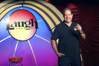 Harry Basil, partner and general manager of the Laugh Factory Las Vegas, poses onstage at the comedy club in the Tropicana Thursday, March 28, 2024. With the Tropicana closing on April 2 to make space for a baseball stadium, the Laugh Factory is looking for a new home.