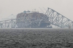 A container ship rests against the wreckage of the Francis Scott Key Bridge on Thursday, March 28, 2024, in Baltimore, Md. 