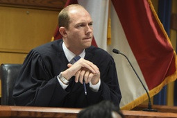 Judge Scott McAfee addresses the lawyers during a hearing on charges against former President Donald Trump in the Georgia election interference case on Thursday, March 28, 2024 in Atlanta.
