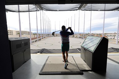 Brett Jones of Las Vegas tees off at Atomic Golf, a new golf entertainment venue, Friday, March 29, 2024.