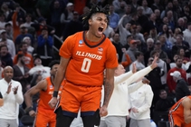 Illinois guard Terrence Shannon Jr. celebrates after a fast break dunk against Iowa State during the second half of the Sweet 16 college basketball game ...