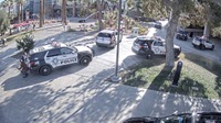 Images of a campus police officer diving behind a patrol vehicle to escape gunfire and then fatally shooting a gunman outside a building at UNLV are among newly ...