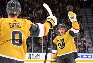Vegas Golden Knights defenseman Noah Hanifin (15) celebrates with center Jack Eichel (9) after scoring against Vancouver Canucks during the first period of an NHL hockey game at T-Mobile Arena Tuesday, April 2, 2024.