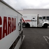 Armored trucks are parked outside the offices of GardaWorld in the Sylmar section of Los Angeles on Thursday, April 4, 2024. Thieves stole as much $30 million in an Easter Sunday burglary at a Los Angeles money storage facility in one of the largest cash heists in city history.
